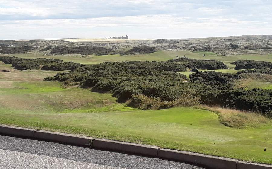Cruden Bay links golf course with Slains Castle in the distance